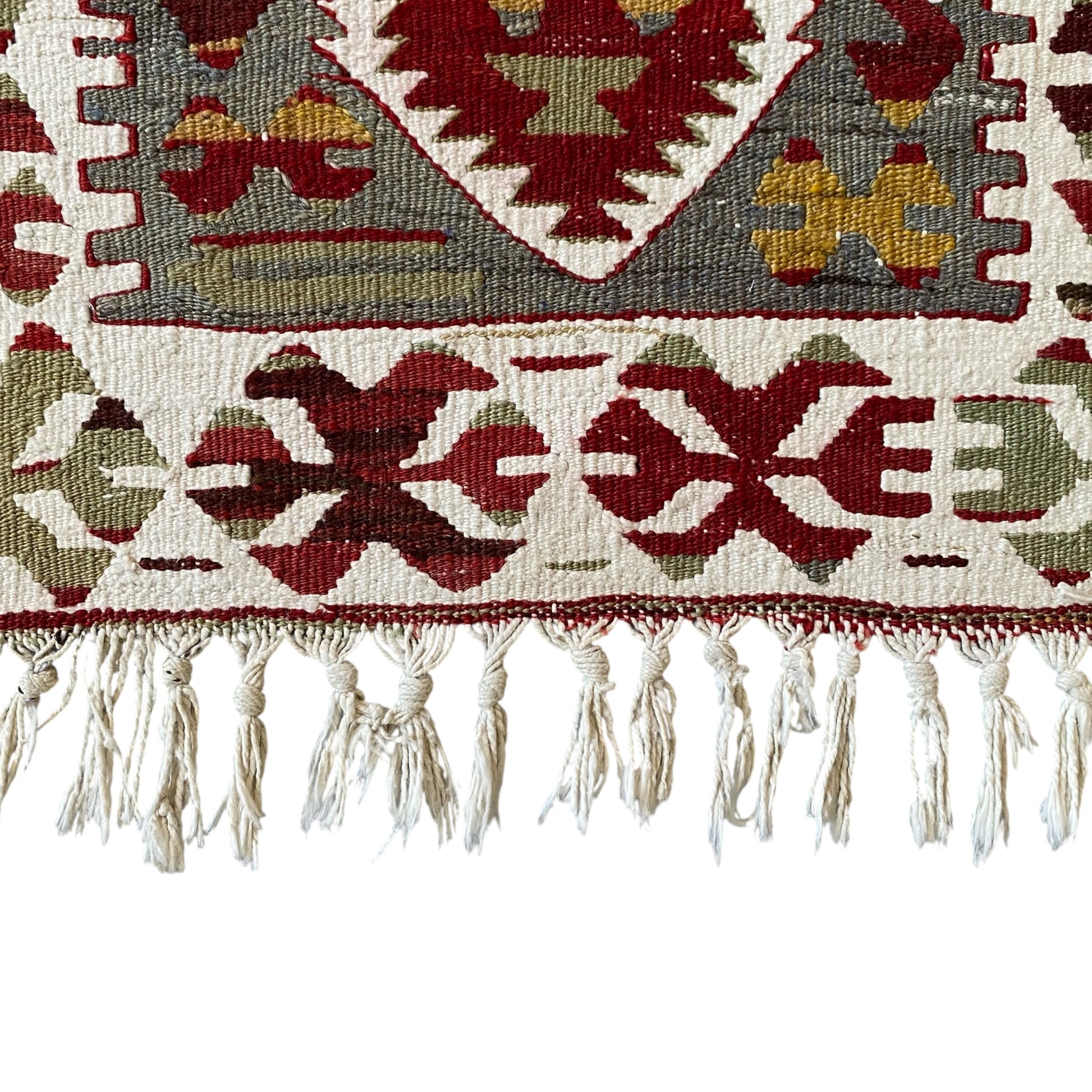 Fringe and lower border detail of Kula Ghordes prayer kilim rug woven with wool and cotton