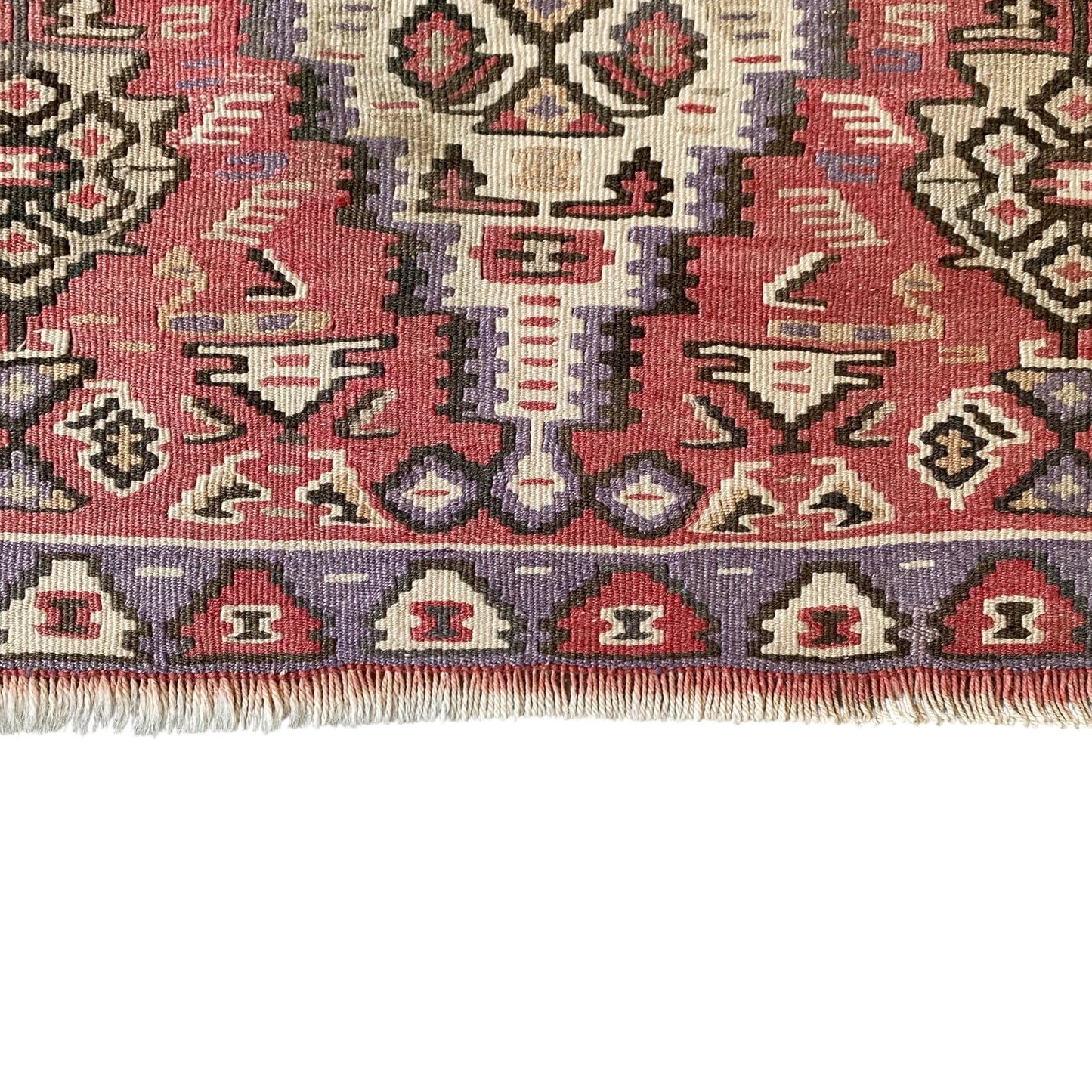 Lower border and fringe detail of vintage Kurdish Senneh kilim rug handwoven from wool