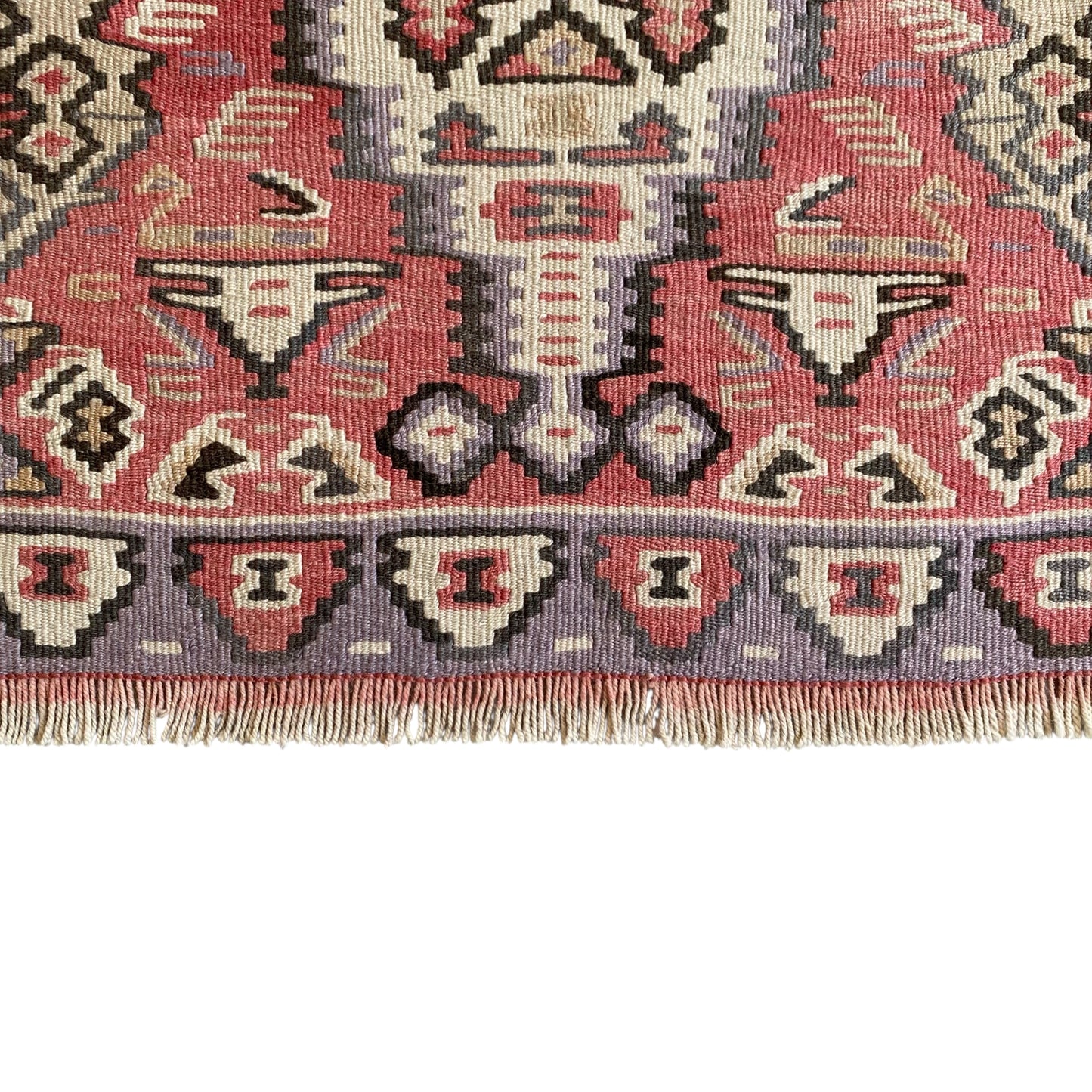 Lower border and fringe detail of vintage Kurdish Senneh kilim rug handwoven from wool