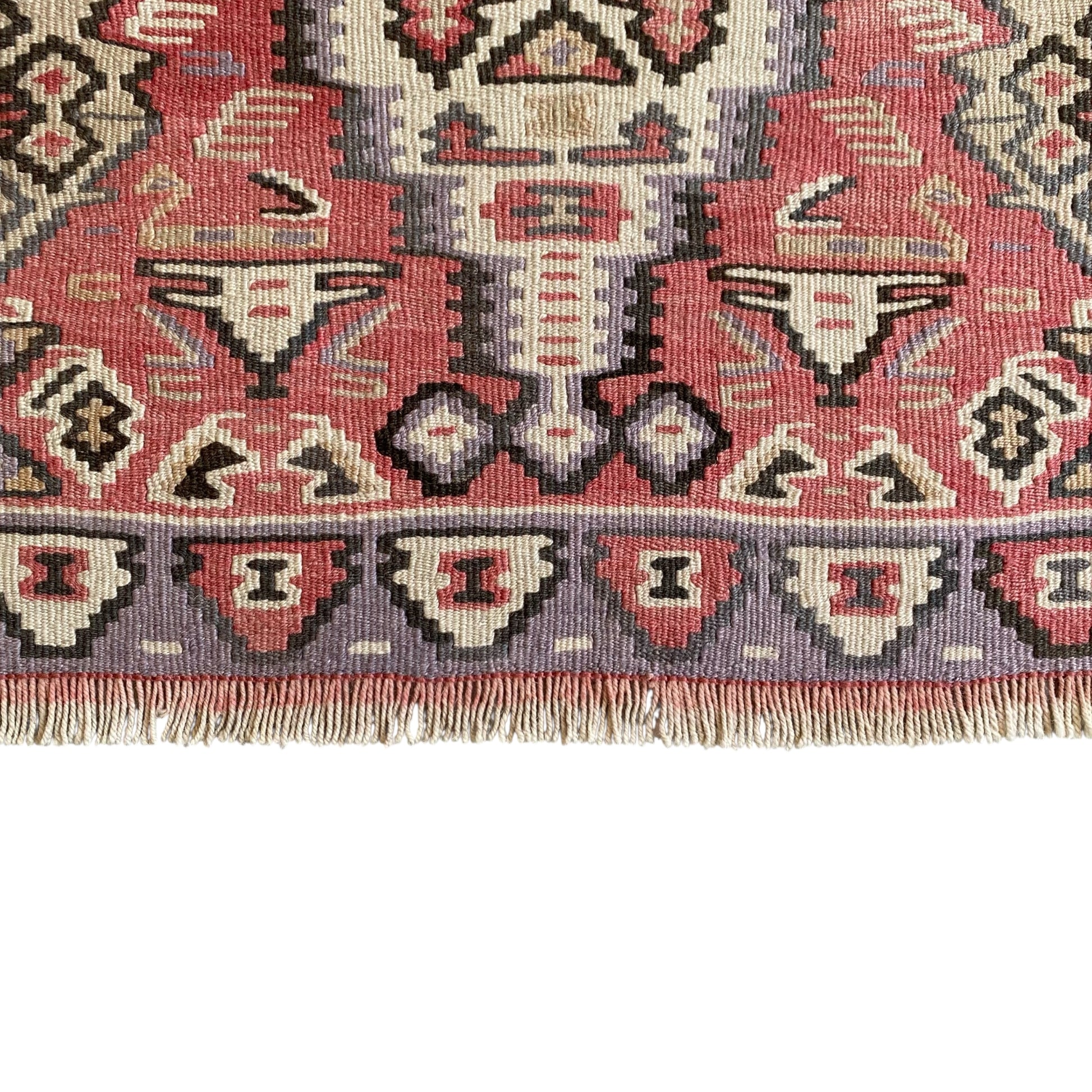 Lower border and fringe detail of vintage Kurdish Senneh kilim rug handwoven from wool